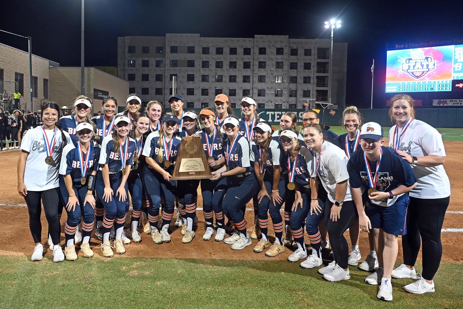 The Bridgeland High School softball team poses for photos following its Class 6A state semifinal game against Denton Guyer.